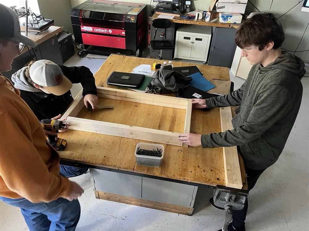  students preparing the new coffee cart at Pulaski Middle-Senior High School.