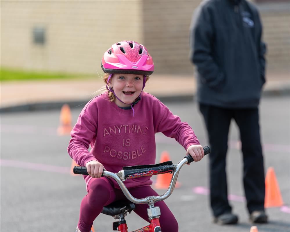  A student at Lura Sharp Elementary School riding around the bike safety course.