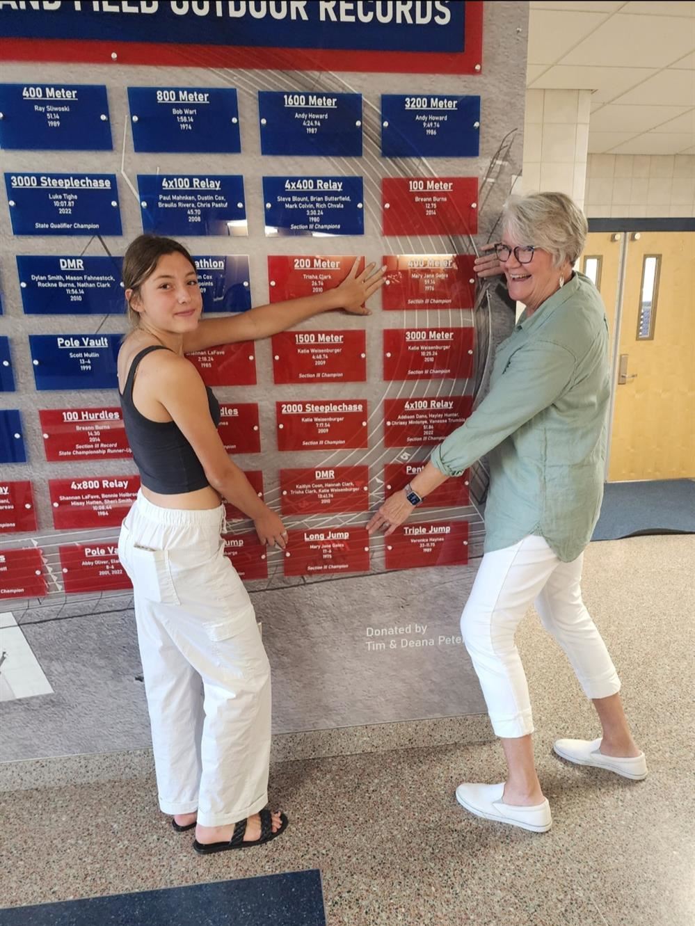 Dye and Gates Montgomery standing in front of the PACS record board back in 2023.